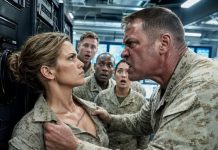 “Shut your mouth, little girl!” the Colonel screamed, violently shoving me against the rack and ripping my uniform. He thought he was breaking a helpless analyst, until he saw the deep combat scar on my chest and realized the terrifying truth about who I really was.