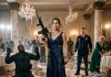 I stood in my torn, blood-stained evening gown, gripping a combat knife and a captured rifle. At my feet, a heavily armed mercenary collapsed on the marble floor. My cowardly husband cowered in absolute terror, finally realizing who he married. But the fight wasn’t over…