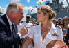 “You’re just a lazy paper-pusher, don’t humiliate your brother today!” my veteran dad hissed, aggressively grabbing my arm in front of hundreds of sailors on the pier. For twenty years, I stayed silent while my family mocked my secret sacrifice. But as the ship’s brass bell rang twice, his arrogant grin vanished when the loudspeakers announced my true rank…
