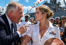 “You’re just a lazy paper-pusher, don’t humiliate your brother today!” my veteran dad hissed, aggressively grabbing my arm in front of hundreds of sailors on the pier. For twenty years, I stayed silent while my family mocked my secret sacrifice. But as the ship’s brass bell rang twice, his arrogant grin vanished when the loudspeakers announced my true rank…