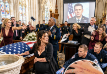At Eight Months Pregnant, I Stood Beside My Husband’s Flag-Draped Casket While His Sister Tried to Pull My Wedding Ring Off My Swollen Finger. His Mother Then Displayed a DNA Report Claiming My Baby Was Not His and Ordered Security to Remove Me. I Thought No One Would Defend Me—until the church screen lit up and my husband’s recorded face addressed his family directly.