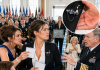 “You Didn’t Earn a Seat Here,” My Sister Said before Snatching My Place Card at Her Husband’s Navy Promotion. I Quietly Moved to the Back of the Auditorium, Still Unable to Explain Where I Had Spent the Last Nineteen Years. Then an Admiral Saw the Small Submarine Pin on My Blazer—and His Question Made Every Officer Turn toward Me.