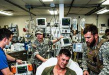 “Don’t you dare touch him with those paddles!” my medic screamed, physically slamming the doctor away from my open, scarred chest. My heart had stopped in the middle of that hellish Texas drill, but what my 500 loyal Marines did next to save my life shocked the entire military.