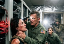 “You survived the mountain blast, but you won’t survive me,” General Vance whispered, his hand choking the life out of me as I lay bleeding. My vision blurred from the pain of my fresh wounds, but I smiled because a shadow was moving right behind him.