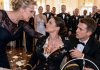 “You don’t belong at this table!” my mother-in-law hissed as she deliberately dumped her plate all over my Dress Blues. My husband grabbed my wrist under the table, forcing me to stay quiet. But when the General opened the secret folder on stage, the entire room gasped at what was inside…