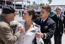 My Father Spilled Water Across My Dress-White Uniform and Ordered Me to Serve Guests at My Brother’s SEAL Ceremony—Then a Four-Star Commander Walked Past the Honored Families, Stopped Directly in Front of Me, Saluted, and Said Two Words That Made Dad’s Veteran Cap Fall From His Hands