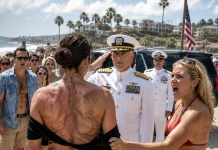 My Sister Pulled My Collar Aside and Laughed at My Scars in Front of Navy Officers. My Father Told Me Not to Make a Scene. Then an Admiral Crossed the Beach and Saluted Me—but His Next Words Made My Father Drop His Glass.