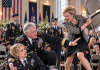 “You’re nothing but trash!” my wealthy stepmother screamed, striking me with a metal chair right on the military stage. My own father stood frozen as I collapsed in my dress uniform. But when the commanding General furiously intervened, his shocking revelation about my true identity left my arrogant family completely ruined…