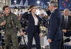 “You’re just a glorified secretary,” my arrogant fighter pilot brother sneered in front of his entire squadron, laughing at my desk job. I stayed completely silent. But the smirks on their faces vanished instantly when the Wing Commander suddenly stormed into the club, looked right at me, and did this…
